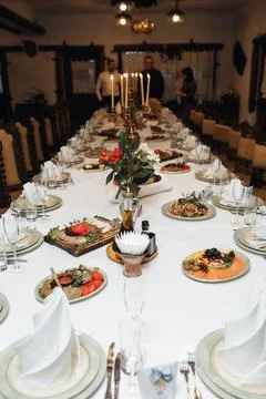 Long table set for a festive gathering Foto stock