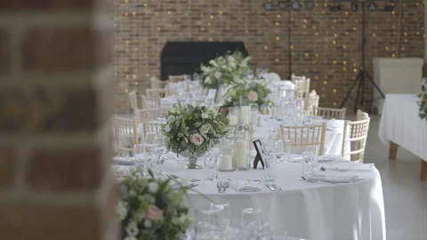 A long table with white tablecloths and white chairs Stock Footage 301626911