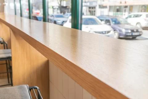 Long table by the window in cafe Stock Photos