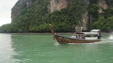 Long tail boat moving through the water in Thailand Stock Footage 62468246