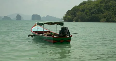 Long tail boat in a postcard background Видео 303749220
