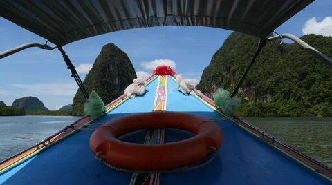 Long tail boat ride through the tropical islands Stock Footage 56442111