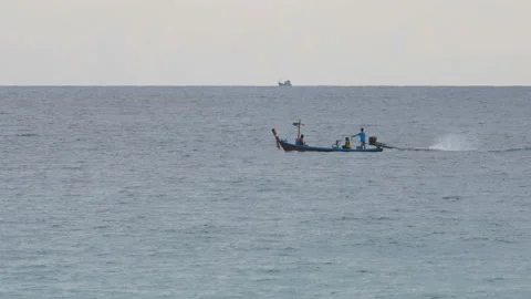Long tail boat sailing in deep sea at day time Stock Footage 134186237