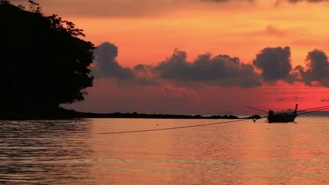 Long tail boat at sunrise. Stock Footage 70879482