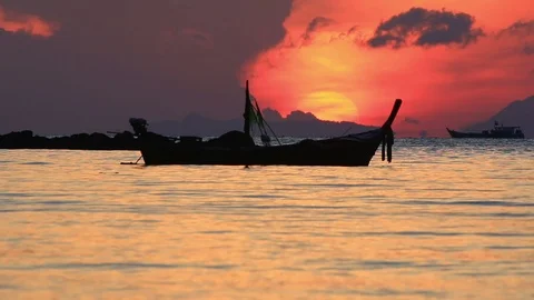 Long tail boat at sunrise. Stock Footage 70879908