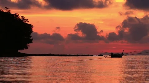 Long tail boat at sunrise. Stock Footage 70879965