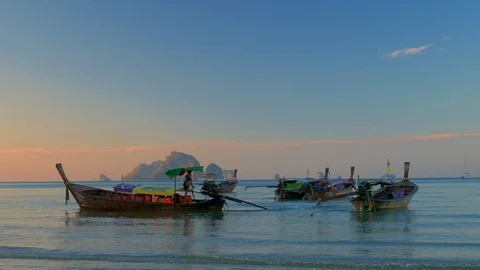 Long tail boat at sunset Stock Footage 107603578