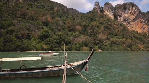 Long tail boat swing on calm waves of Andaman sea Stock Footage 109122918