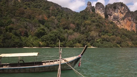 Long tail boat swing on calm waves of Andaman sea Stock Footage 109122983