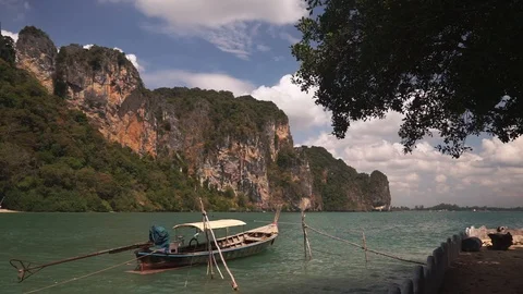 Long tail boat swing on calm waves of Andaman sea Stock Footage 109124333