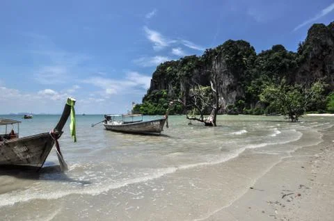 Long tail boat on tropical beach railay krabi thailand Stock Photos