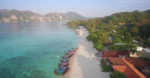 Long Tail Boats On Long Beach, Phi Phi Islands, Aerial Flyover Shot Stock Footage 78774271