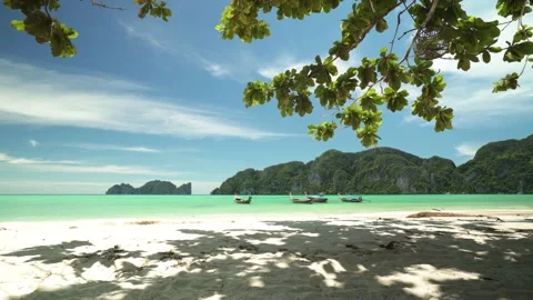 Long tail boats on Phi Phi island Thailand with Phi Phi Lagoon island landscape Stock Footage 153505826