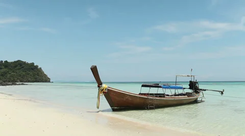 Long-tailed Boat on a beach with blue sky Stock Footage 36545547