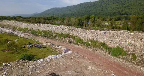 Long take bird's eye view of garbage mountain from drone in the industrial zone. Video stock 96639441