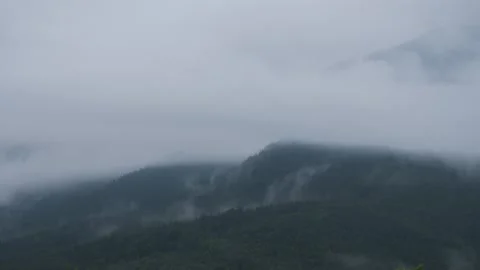 Long term day to night timelapse of fog and clouds passing over mountains Stock Footage 152871512