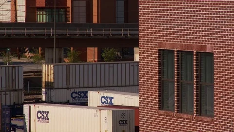 Long tight shot of CSX train yard in Atlanta, Georgia as MARTA subway passes Video stock 74490081