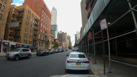 Long timelapse of Traffic passing parked cars in midtown Manhattan New York City Video stock 143363178