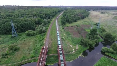 A long train across the river, a railway bridge across the river Stock Footage 83158127