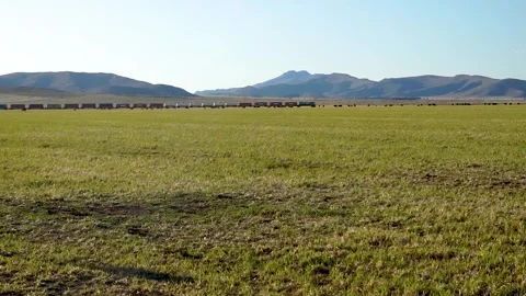 Long train in the distance going through a beautiful country landscape with.. Stock Footage 252396655