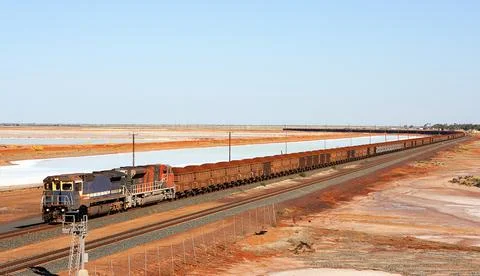 Long train with iron-ore in the outback of australia Stock Photos