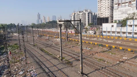 Long train passing by through train station without stopping, mumbai, mahindra Stock Footage 145047025