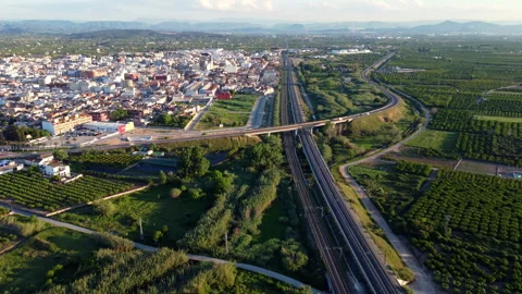 Long train tracks next to a small town and farmland. Stock Footage 258287718