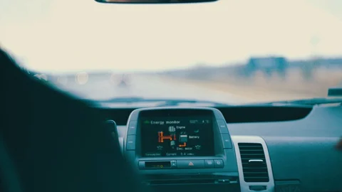 Long trip by car man drives a hybrid vechicle with girl Stock Footage 128170643