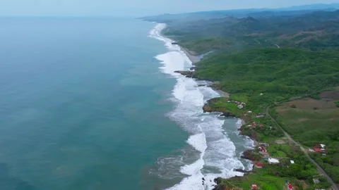 Long tropical coastline with waves and green hills at Bejuco, Costa Rica Stock Footage 345335991