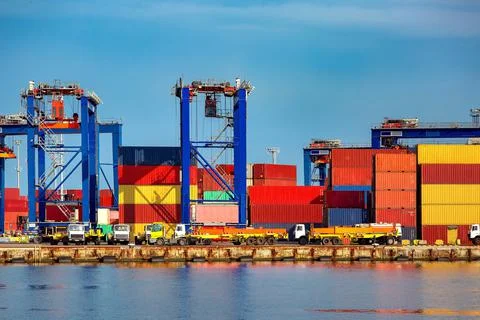 Long trucks in container depot in import and export area. Stock Photos