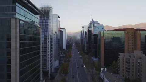 Long twilight drone glide along Sanhattan office corridor Santiago Chile Vídeos de archivo 334637264