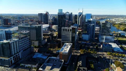 Long, two-minute dolly left from Cumberland River to Music City Center Stock Footage 122539084