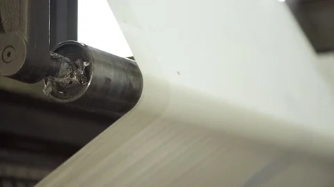 Long uncut clear paper on rolling machine in printing house Stock Footage 71509124