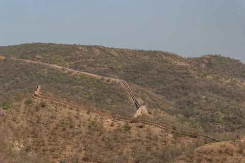 Long View of Ancient Fortification Wall Ascending a Dry Hillside in Rajasthan Stock Photos