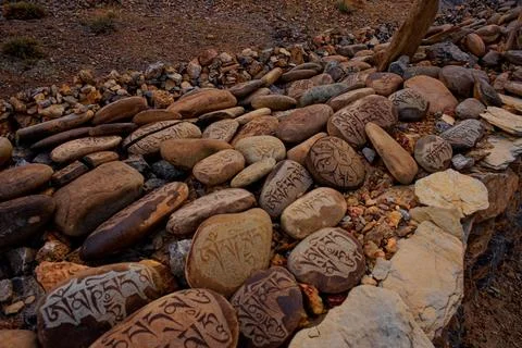 Long wall of prayer or Mani stones Stock Photos
