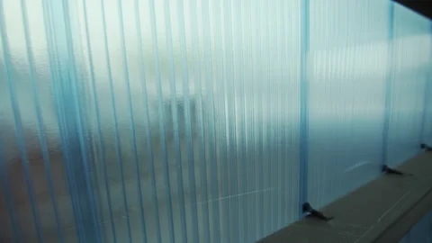 Long wall of room made of hollow polycarbonate sheets Stock Footage 228780258