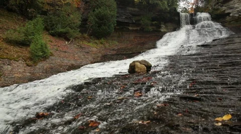 Long waterfall down sandstone hill Stock Footage 44212986