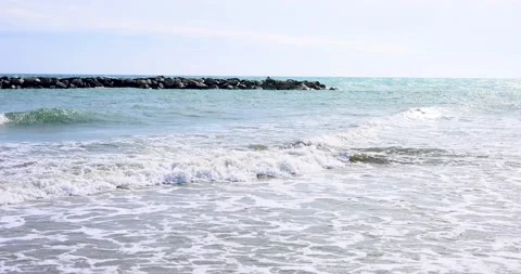 Long waves on the beach in the late winter sun Stock Footage 213237501