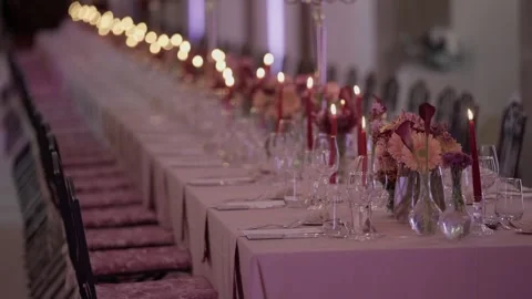 Long Wedding Banquet Table with Red Candles Flowers and Wine Glasses 動画素材 343751330