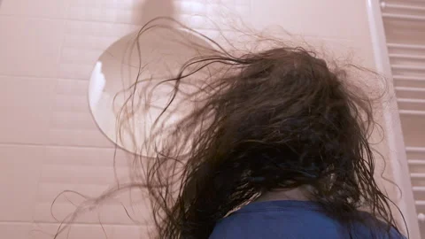 Long wet hair develops in the bathroom Video stock 255745251