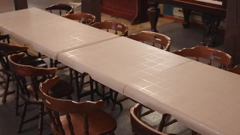 A long white table with chairs. Stock Footage 252559547