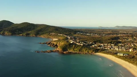 Long wide aerial hovering over One Mile beach in Forster Pacific coast as 4k. Stock Footage 200434285