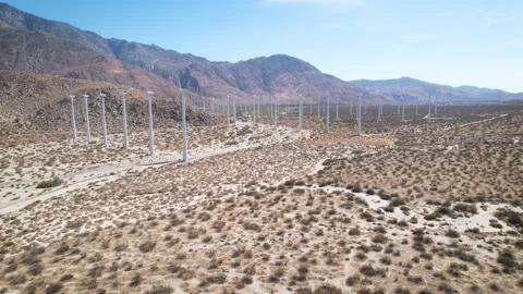Long Wind Turbine Rows and Mountain Ridge, 4K Stock Footage 197018194