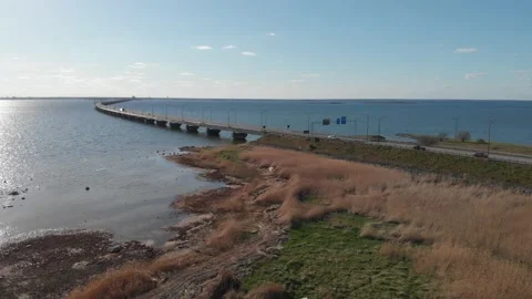 Long Winding Oland Bridge Seen from Farjestaden side, Sweden, Aerial Tilt Up Stock Footage 209778639