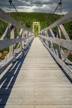 Long wooden hiking bridge Stock Photos