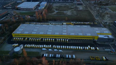 Long yellow DHL distribution center Berlin. Majestic aerial view flight drone Stock Footage 321819800