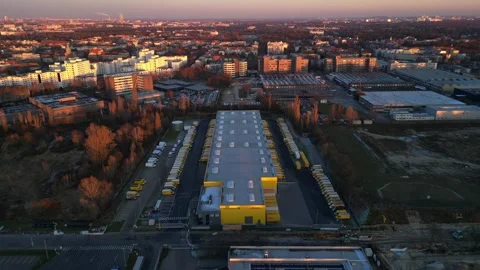 Long yellow DHL distribution center Berlin. Nice aerial view flight drone Stock Footage 321819838