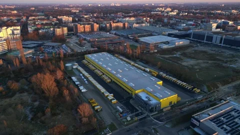 Long yellow DHL distribution center Berlin. Smooth aerial view flight drone Stock Footage 321819852