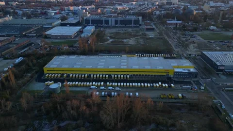 Long yellow DHL distribution center Berlin. Fantastic aerial view flight drone Stock Footage 321819874