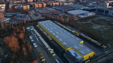 Long yellow DHL distribution center Berlin. Unique aerial view flight drone Stock Footage 321819905